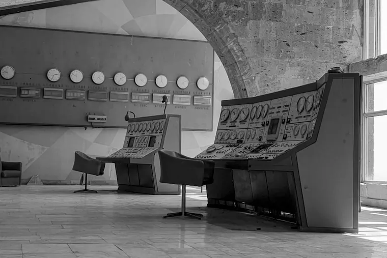 A disused control room, instrument panels still wired in place