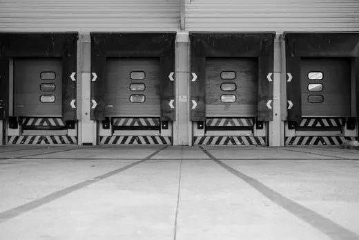 Painted lane markings across an empty freight yard
